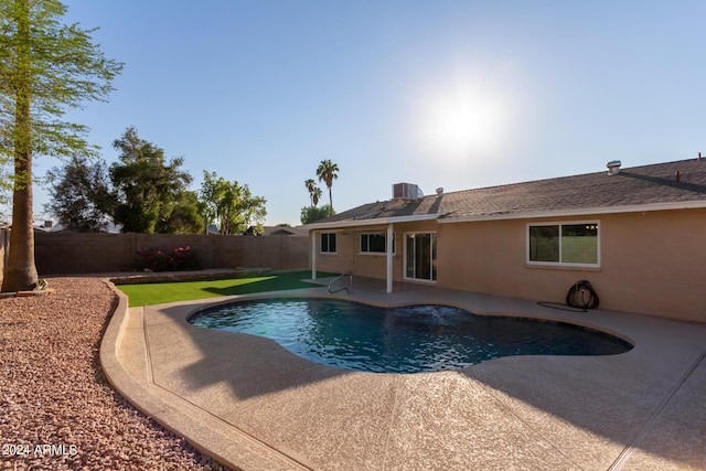 view of pool with a patio area, a fenced backyard, a fenced in pool, and central AC unit