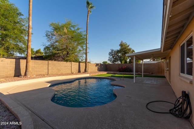 view of pool featuring a fenced backyard, a fenced in pool, and a patio