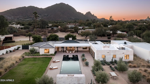 aerial view at dusk with a mountain view