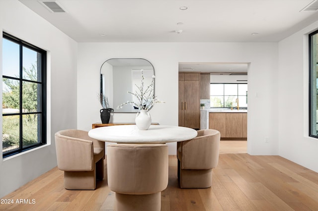 dining area with light wood-type flooring