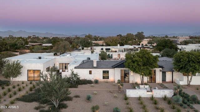 aerial view at dusk with a mountain view