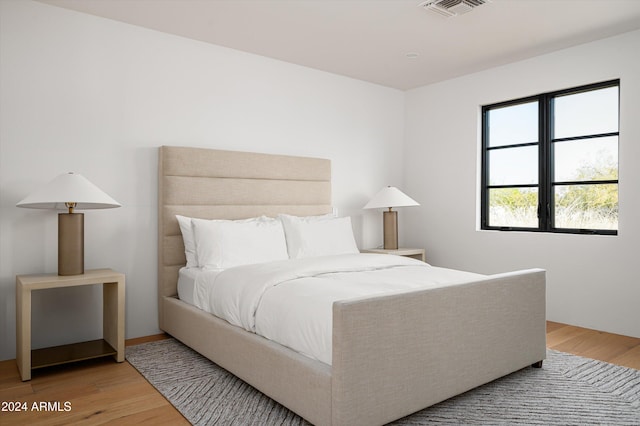 bedroom with light hardwood / wood-style floors