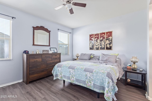 bedroom with wood finished floors, a ceiling fan, and baseboards