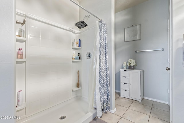 bathroom featuring a shower stall and tile patterned floors