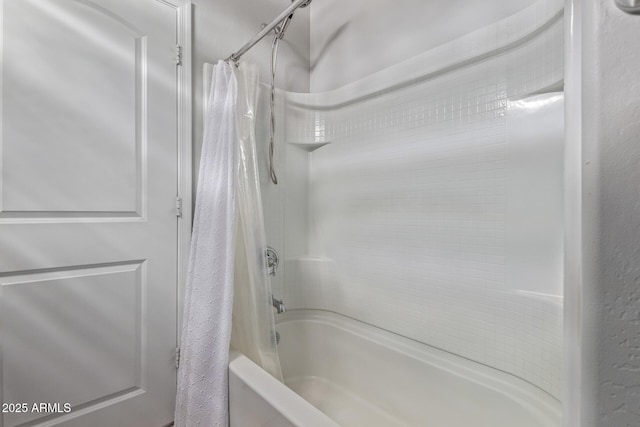 bathroom featuring shower / bath combo with shower curtain