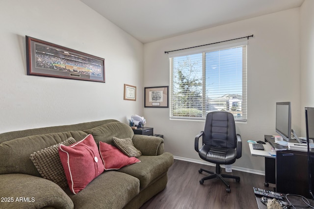 office featuring baseboards, vaulted ceiling, and wood finished floors