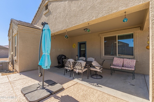 view of patio / terrace featuring central AC unit and outdoor dining space