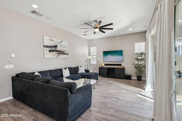 living room featuring ceiling fan