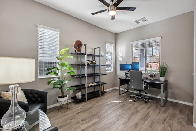 office area with wood-type flooring and ceiling fan