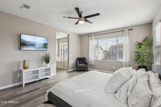 bedroom featuring ensuite bathroom, hardwood / wood-style floors, and ceiling fan