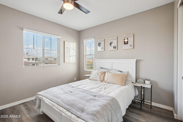 bedroom with ceiling fan and dark hardwood / wood-style flooring