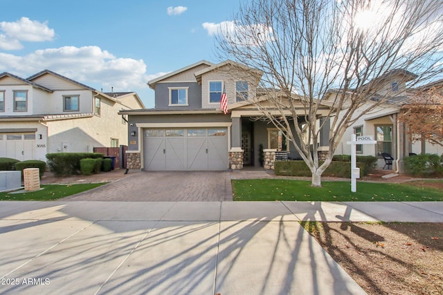 view of front of home with a garage and a front lawn