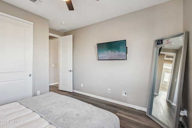 bedroom featuring dark hardwood / wood-style floors and ceiling fan