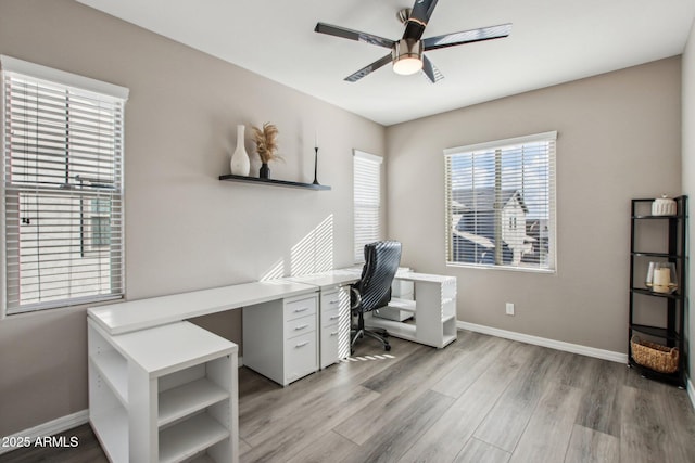 office space with ceiling fan and hardwood / wood-style floors