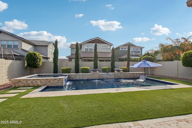 view of swimming pool featuring an in ground hot tub, pool water feature, and a yard