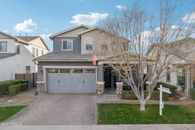 view of front of property with a garage and a front yard