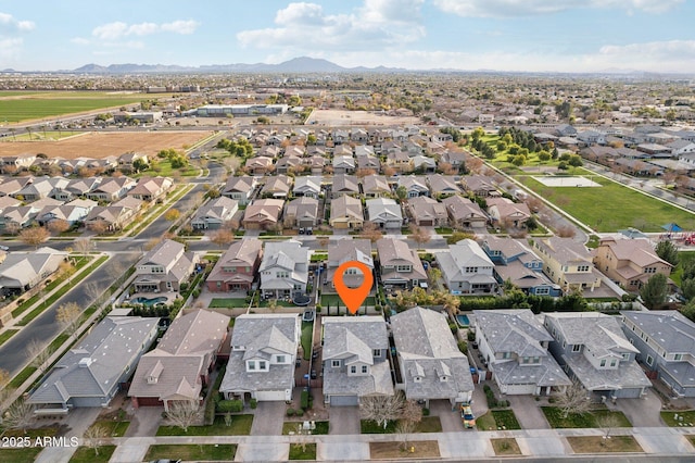 birds eye view of property featuring a mountain view