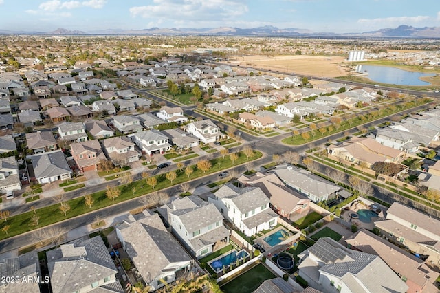 bird's eye view with a water and mountain view