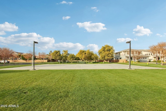 view of property's community with a lawn