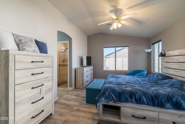 bedroom featuring lofted ceiling, ceiling fan, and light hardwood / wood-style flooring