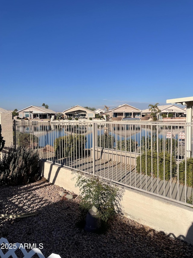 view of gate featuring a water view