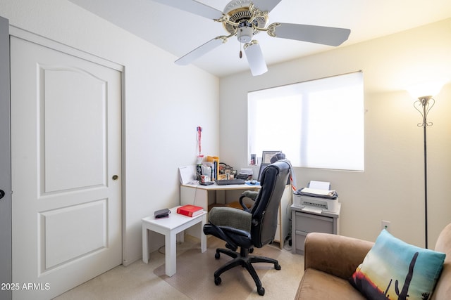 office area featuring light colored carpet and ceiling fan