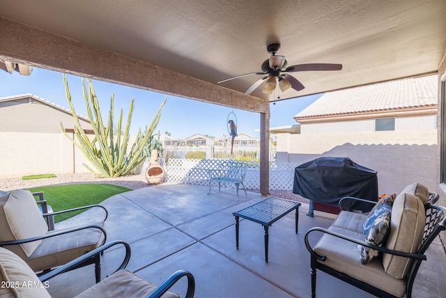 view of patio with ceiling fan and a grill