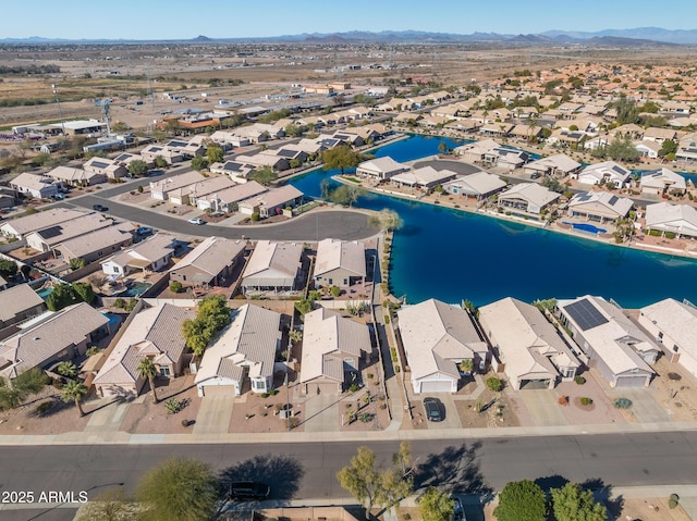 birds eye view of property featuring a water and mountain view