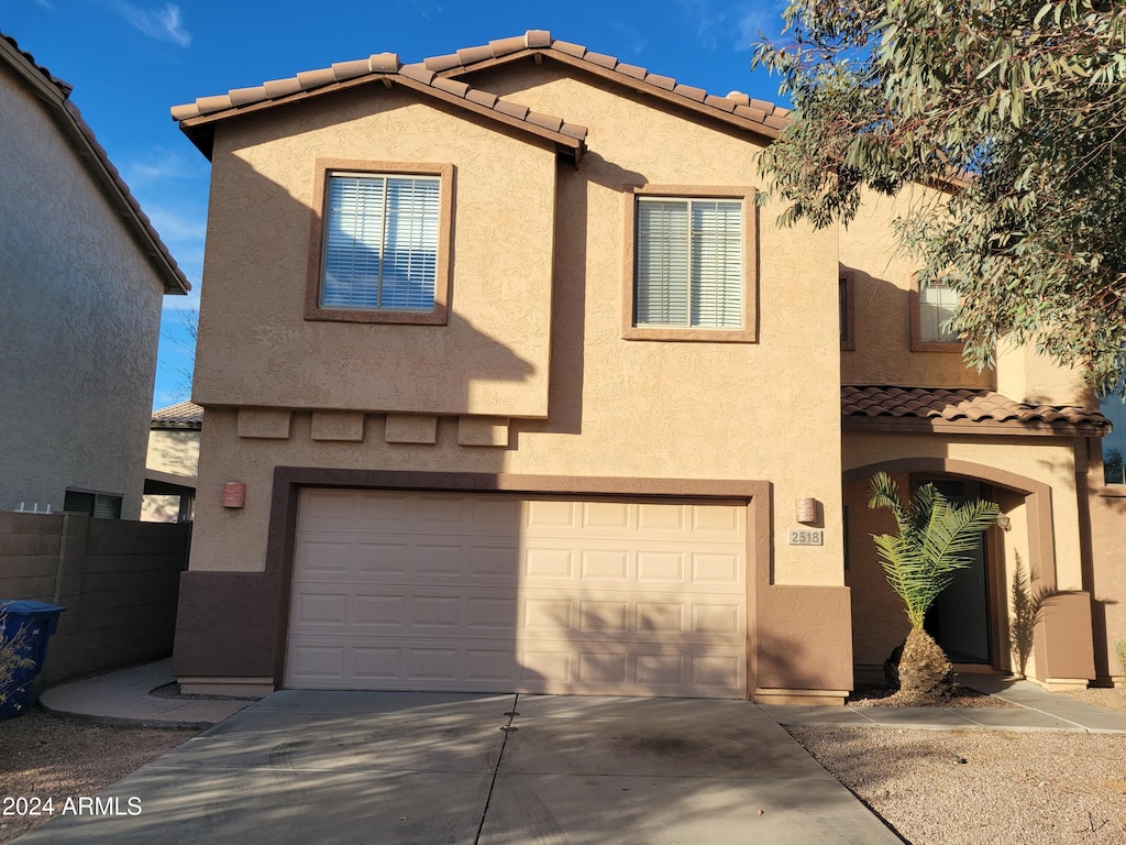 view of front of property with a garage