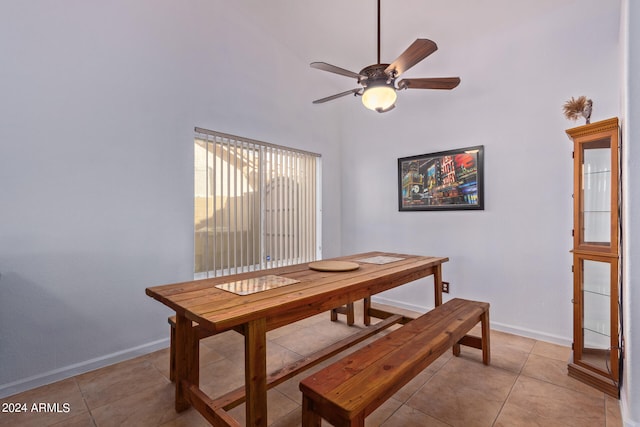 tiled dining area with ceiling fan