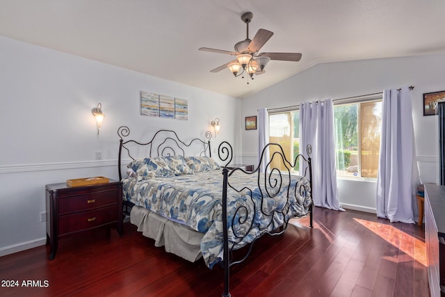 bedroom with ceiling fan, lofted ceiling, and dark hardwood / wood-style flooring