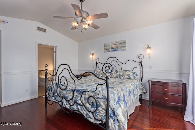 bedroom featuring ceiling fan, vaulted ceiling, dark hardwood / wood-style floors, and ensuite bathroom