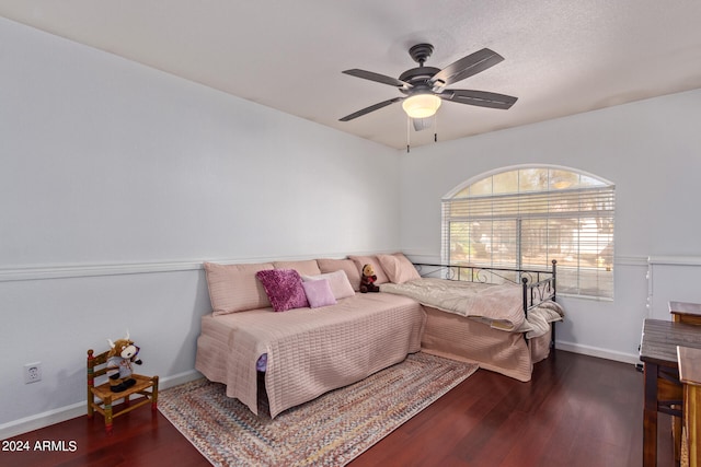 bedroom featuring dark wood-type flooring and ceiling fan