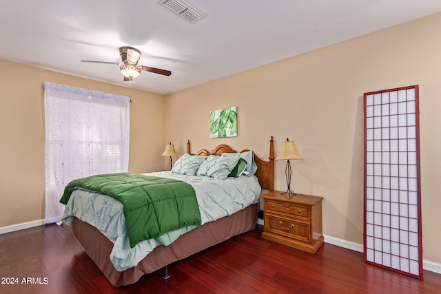 bedroom featuring dark wood-type flooring and ceiling fan