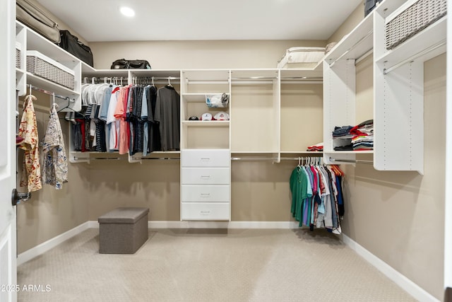 walk in closet featuring carpet floors