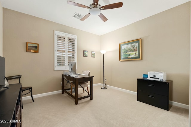 office area with light carpet, baseboards, visible vents, and a ceiling fan