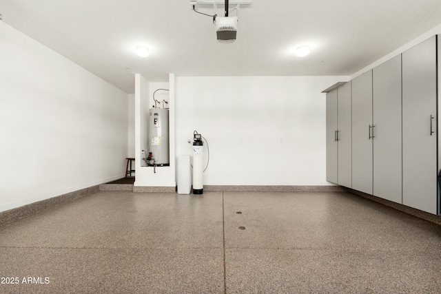 garage featuring water heater, baseboards, and a garage door opener