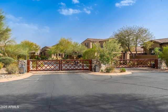 view of gate with fence