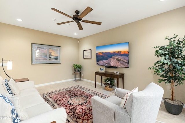 living room featuring ceiling fan, light tile patterned floors, recessed lighting, and baseboards