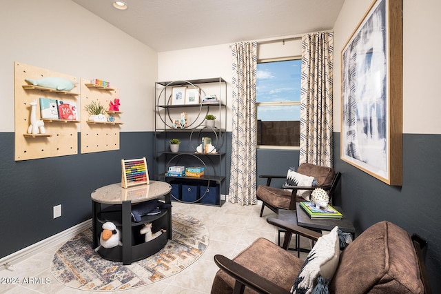 sitting room with baseboards, recessed lighting, and tile patterned floors