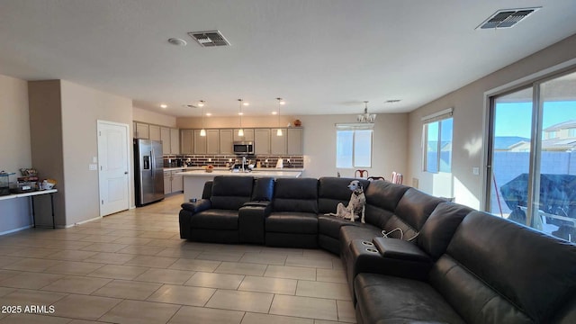 living room featuring an inviting chandelier