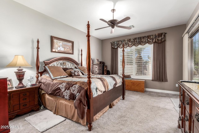 bedroom featuring visible vents, baseboards, ceiling fan, light colored carpet, and lofted ceiling