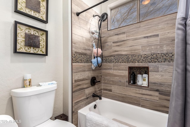 bathroom featuring toilet, shower / tub combo, and a textured wall