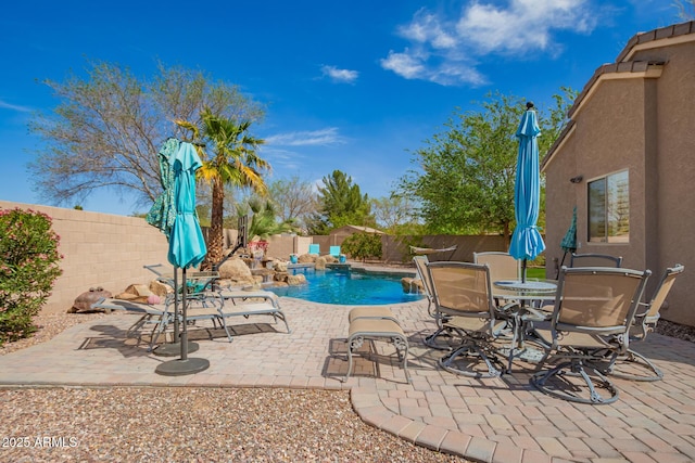 view of pool with a patio area, a fenced backyard, and a fenced in pool