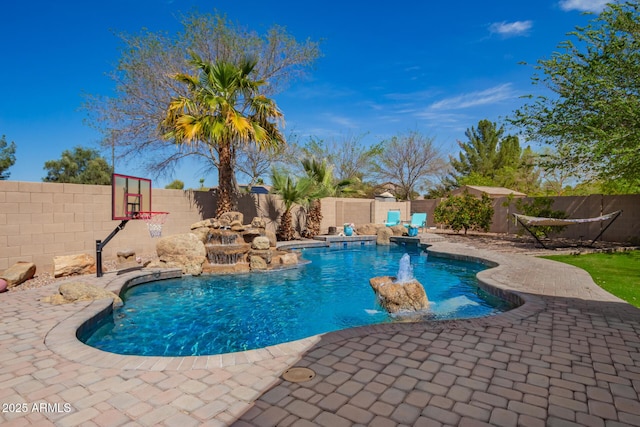 view of swimming pool featuring a patio area, a fenced backyard, and a fenced in pool