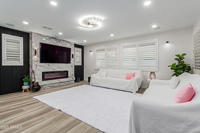 1501 E Rakestraw Ln, Gilbert, AZ 85298 - living room featuring wood finished floors, a fireplace, recessed lighting, and baseboards