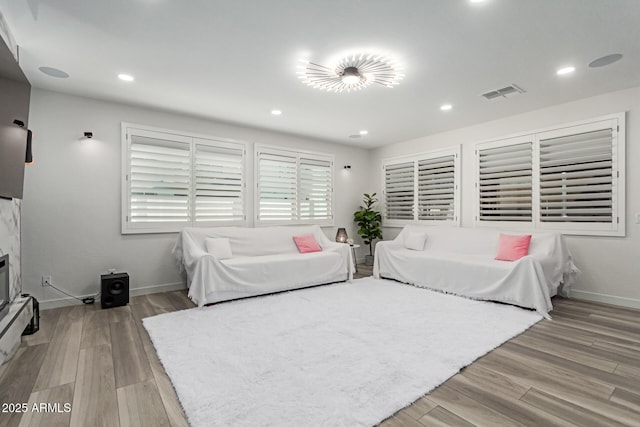 1501 E Rakestraw Ln, Gilbert, AZ 85298 - living room with wood finished floors, baseboards, and recessed lighting