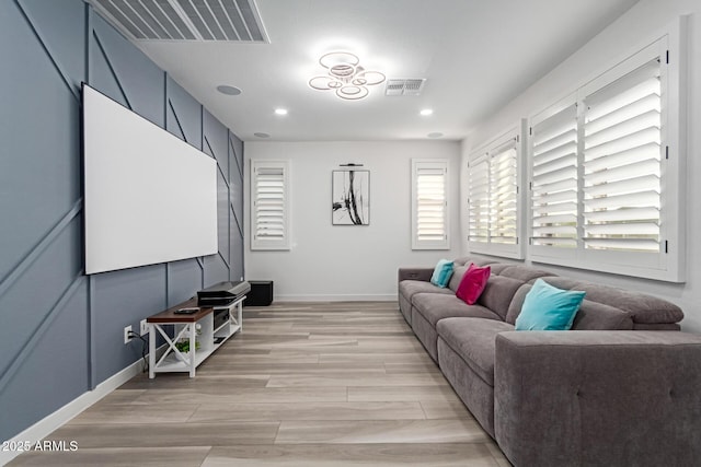 1501 E Rakestraw Ln, Gilbert, AZ 85298 - living room with light wood-style floors, baseboards, and recessed lighting