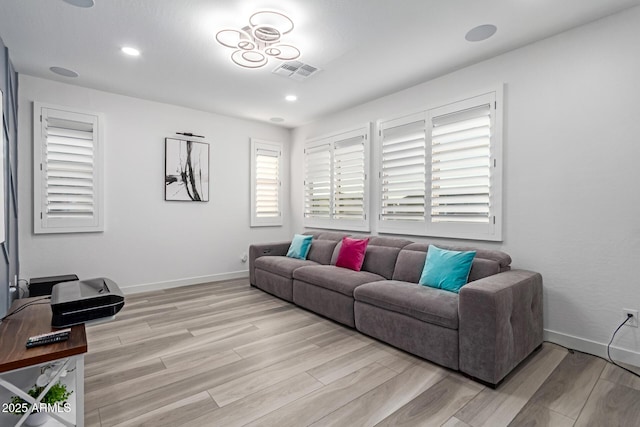 1501 E Rakestraw Ln, Gilbert, AZ 85298 - living room with light wood-style flooring, baseboards, and recessed lighting