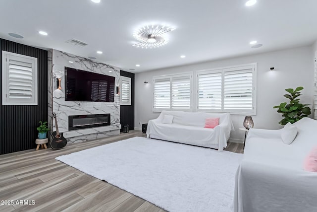1501 E Rakestraw Ln, Gilbert, AZ 85298 - living area with wood finished floors, recessed lighting, a fireplace, and baseboards